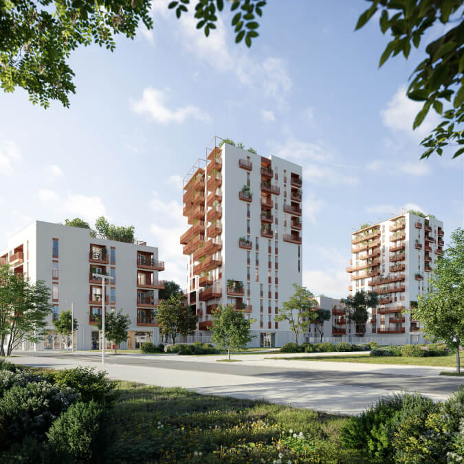 Vista delle moderne torri residenziali circondate da alberi e spazi verdi, parte di un progetto di rigenerazione urbana.